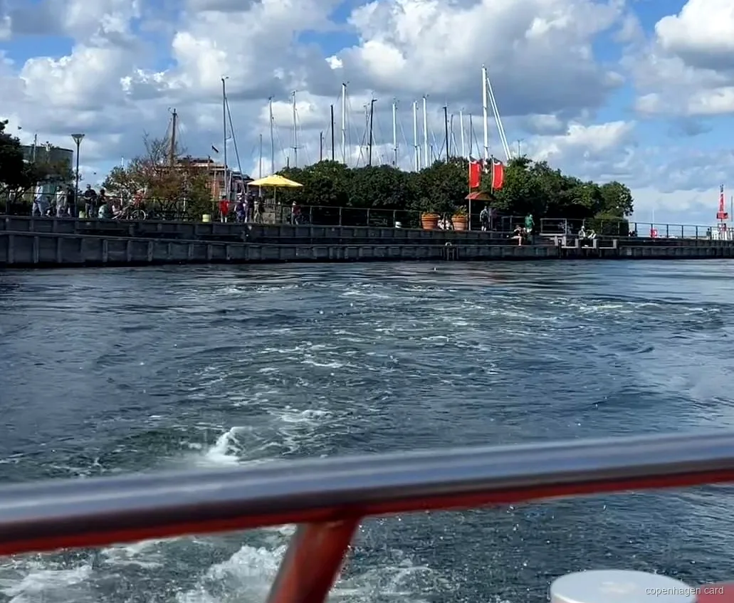 Copenhagen Canal Cruise boat departing Ved Stranden past historic waterfront buildings