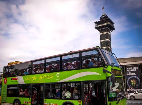 Visitor boarding a Copenhagen sightseeing bus included with the Copenhagen Card Hop