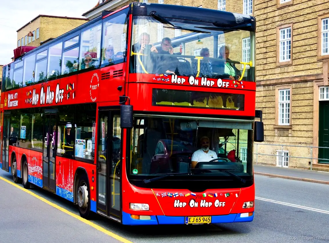 Copenhagen Hop-On Hop-Off Bus eco-friendly double-decker at a city stop